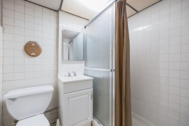 2117 38th St, Astoria, NY 11105 - full bath featuring a tile shower, vanity, and tile walls