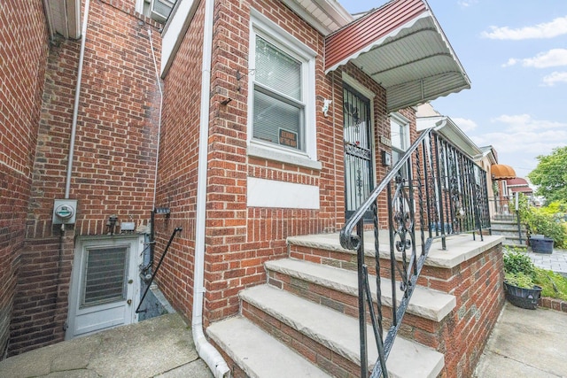 2117 38th St, Astoria, NY 11105 - view of exterior entry featuring brick siding