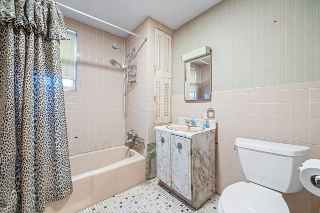 2117 38th St, Astoria, NY 11105 - bathroom featuring shower / bathtub combination with curtain, tile walls, vanity, wainscoting, and tile patterned flooring