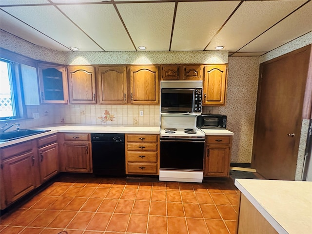 384 Hawthorne Ave, Yonkers, NY 10705 - kitchen featuring electric stove, dishwasher, light countertops, light tile patterned flooring, and wallpapered walls