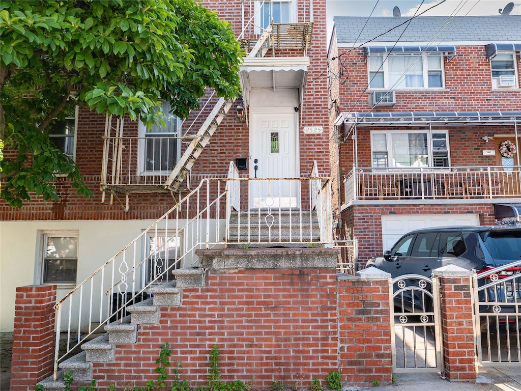 2525 Radcliff Ave, Bronx, NY 10469 - doorway to property featuring brick siding and a gate