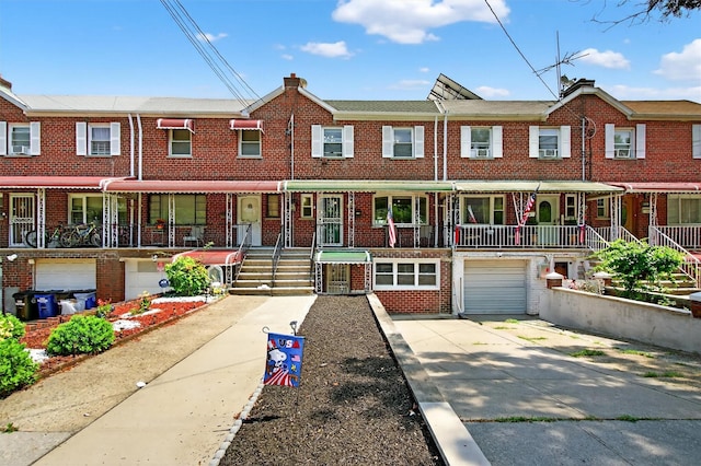 1004 Balcom Ave, Bronx, NY 10465 - view of property with brick siding, concrete driveway, and an attached garage