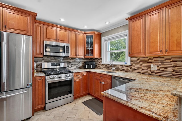 1004 Balcom Ave, Bronx, NY 10465 - kitchen featuring stainless steel appliances, brown cabinetry, light stone countertops, tasteful backsplash, and ornamental molding
