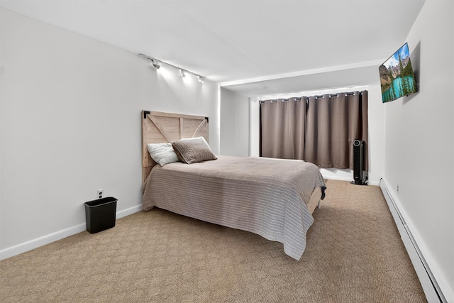 1004 Balcom Ave, Bronx, NY 10465 - carpeted bedroom featuring a baseboard radiator and track lighting