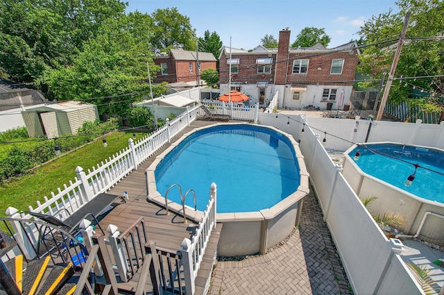 1004 Balcom Ave, Bronx, NY 10465 - view of pool with a fenced backyard and a storage shed