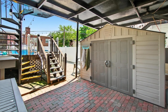 1004 Balcom Ave, Bronx, NY 10465 - view of patio / terrace featuring stairway and a storage shed