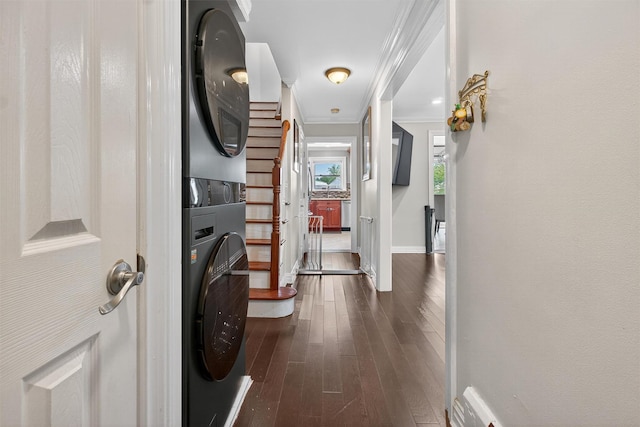 1004 Balcom Ave, Bronx, NY 10465 - hallway featuring stacked washer / dryer, crown molding, and dark wood-style flooring