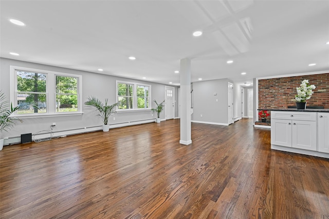 70 Robinson Ave, Brookhaven, NY 11763 - unfurnished living room featuring dark wood-style flooring, recessed lighting, and a baseboard heating unit