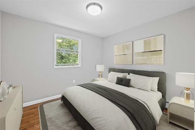 70 Robinson Ave, Brookhaven, NY 11763 - bedroom featuring wood finished floors and baseboards