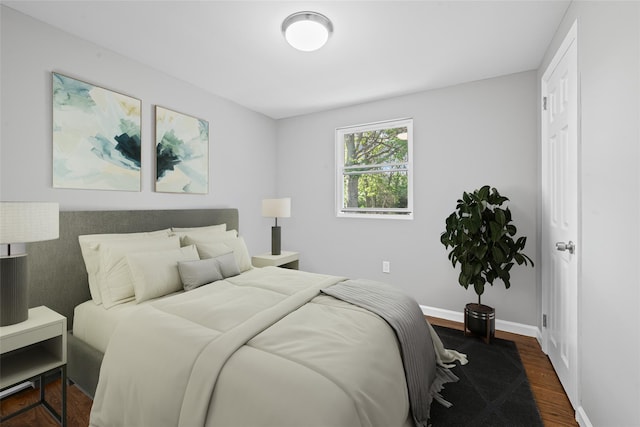 70 Robinson Ave, Brookhaven, NY 11763 - bedroom featuring dark wood-type flooring and baseboards