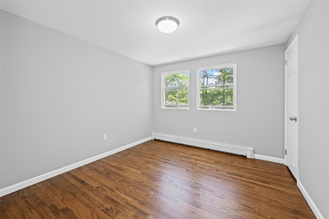 70 Robinson Ave, Brookhaven, NY 11763 - empty room with baseboard heating and wood finished floors
