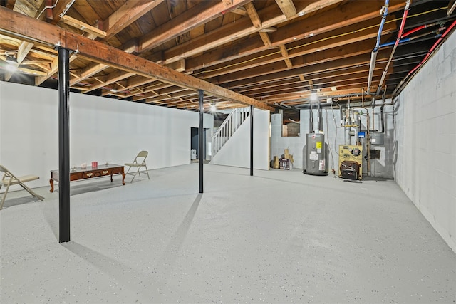 70 Robinson Ave, Brookhaven, NY 11763 - unfinished below grade area with electric water heater, stairway, concrete block wall, and a heating unit