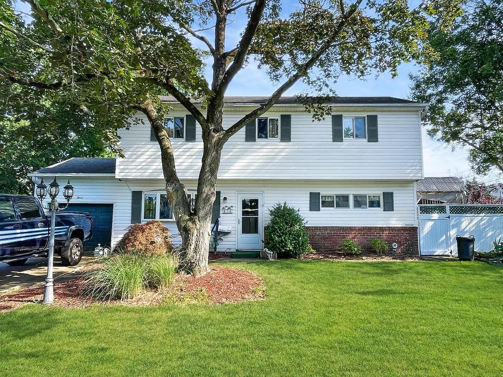 3 Woods Ln, Centereach, NY 11720 - view of front of home featuring an attached garage
