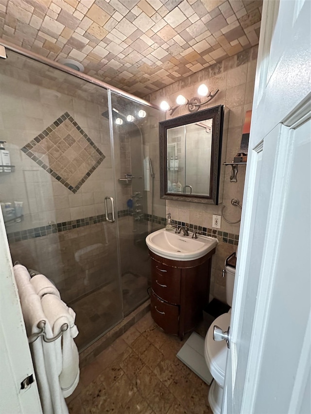 1 Birchwood Ct Unit 3H, Mineola, NY 11501 - bathroom featuring tile walls, vanity, a shower stall, and decorative backsplash