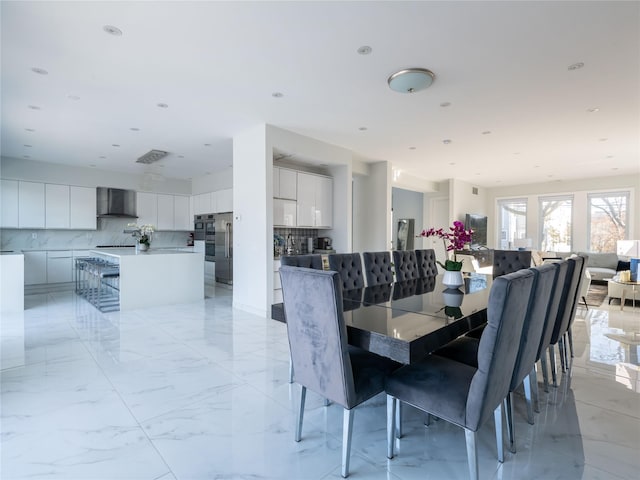 85 Erie Ave, Atlantic Beach, NY 11509 - dining area featuring light marble finish floors