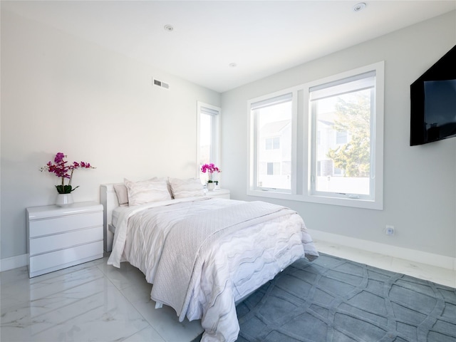 85 Erie Ave, Atlantic Beach, NY 11509 - bedroom featuring light marble finish floors and baseboards