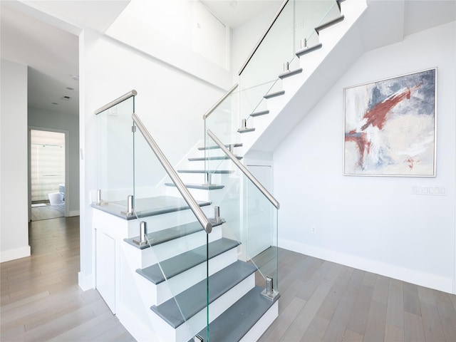85 Erie Ave, Atlantic Beach, NY 11509 - stairs featuring wood finished floors and baseboards