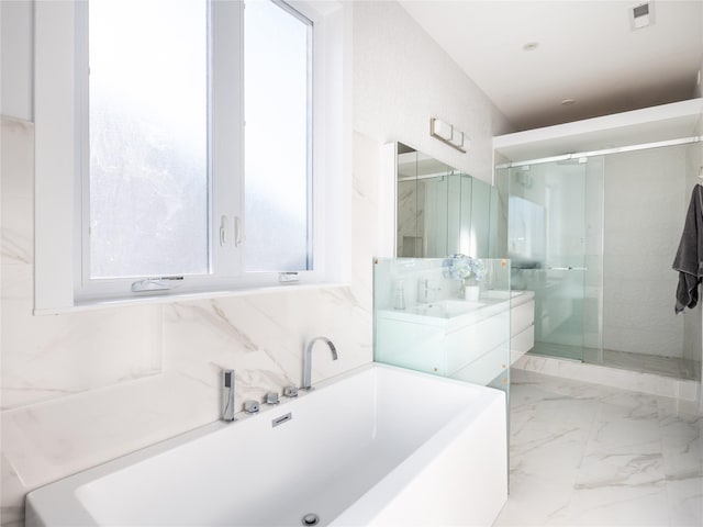 85 Erie Ave, Atlantic Beach, NY 11509 - bathroom featuring a tub to relax in, a stall shower, vanity, and marble finish floors