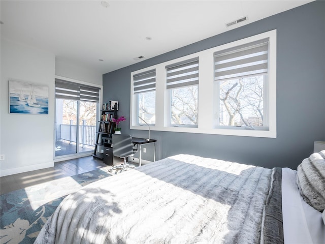 85 Erie Ave, Atlantic Beach, NY 11509 - bedroom with access to exterior and wood finished floors
