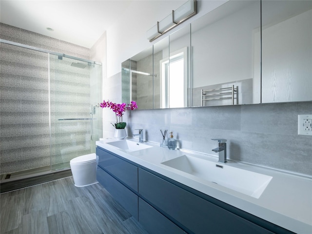 85 Erie Ave, Atlantic Beach, NY 11509 - full bath featuring a towel warmer, a shower stall, and double vanity