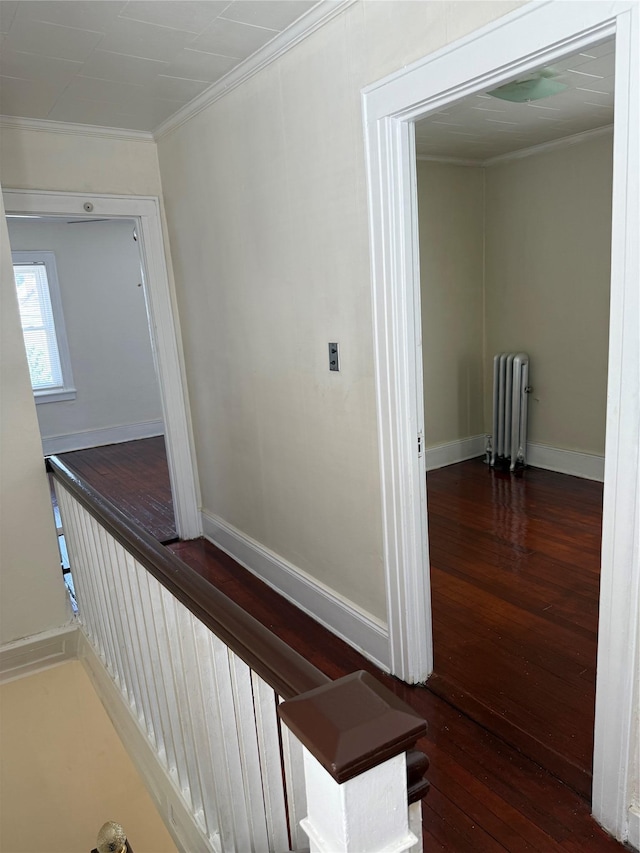 9030 202nd St, Hollis, NY 11423 - hallway featuring radiator, crown molding, and hardwood / wood-style floors