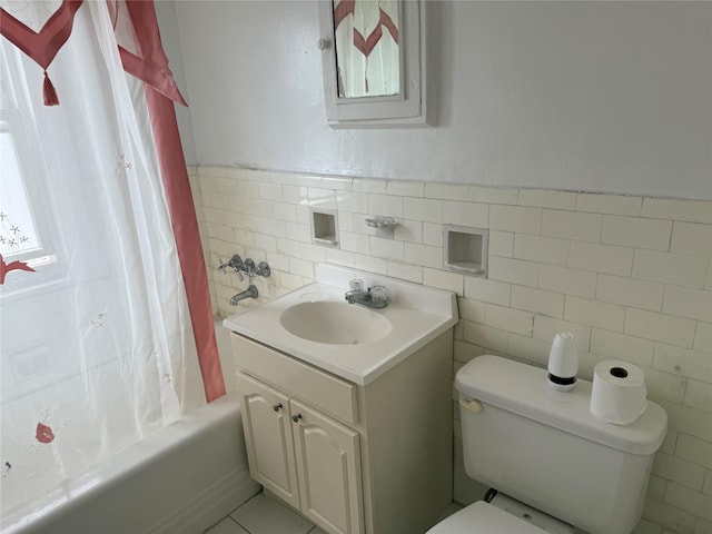 9030 202nd St, Hollis, NY 11423 - bathroom featuring vanity, tile walls, shower / bath combo, and wainscoting