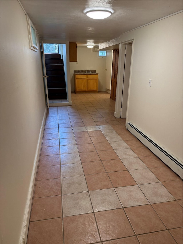 9030 202nd St, Hollis, NY 11423 - hallway with light tile patterned floors, stairs, and healthy amount of natural light