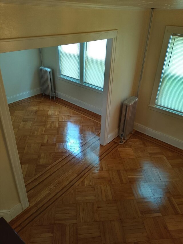 9030 202nd St, Hollis, NY 11423 - spare room with radiator and plenty of natural light