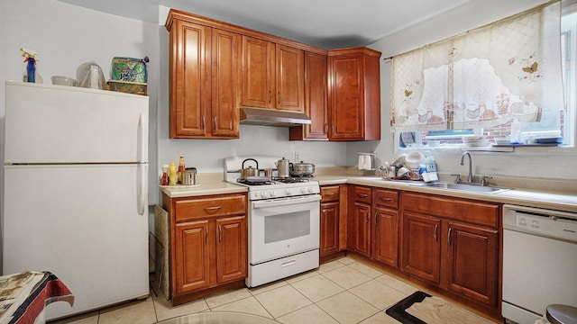 85-35 Parsons Blvd, Briarwood, NY 11435 - kitchen with white appliances, under cabinet range hood, light tile patterned flooring, and light countertops