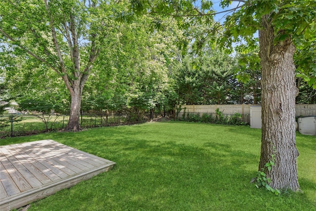5 Coolidge Rd, Hampton Bays, NY 11946 - fenced backyard with a wooden deck