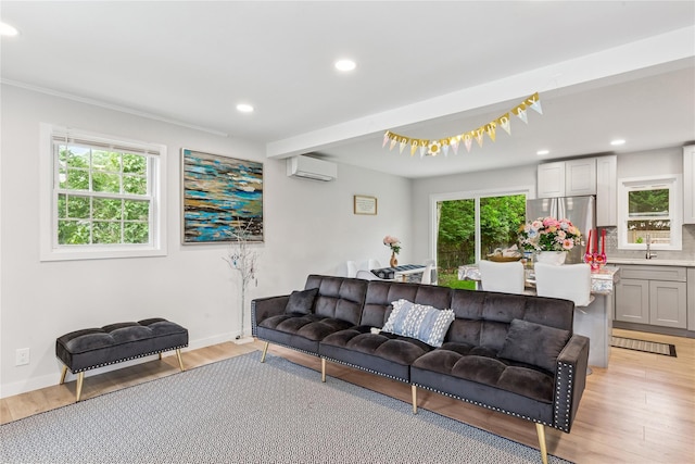 5 Coolidge Rd, Hampton Bays, NY 11946 - living room featuring a wall mounted air conditioner, light wood finished floors, and recessed lighting