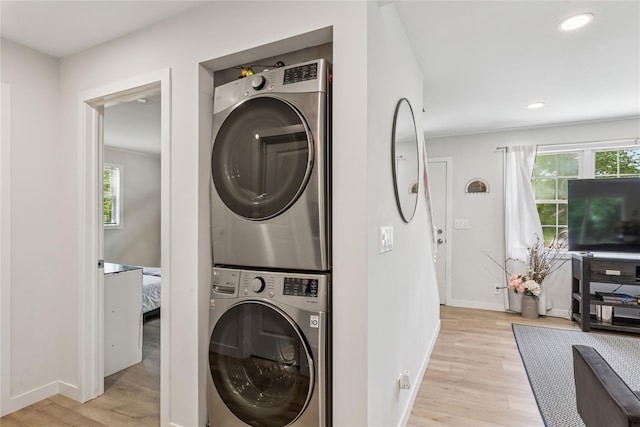5 Coolidge Rd, Hampton Bays, NY 11946 - laundry area with stacked washer / drying machine, light wood-style flooring, and recessed lighting