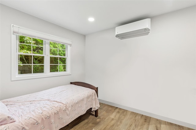 5 Coolidge Rd, Hampton Bays, NY 11946 - bedroom with a wall mounted AC, wood finished floors, and recessed lighting