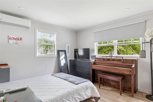 5 Coolidge Rd, Hampton Bays, NY 11946 - bedroom featuring an AC wall unit, multiple windows, crown molding, light wood-type flooring, and recessed lighting