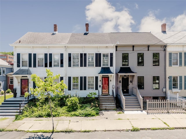 24 8th St, Hudson, NY 12534 - townhome / multi-family property featuring a chimney