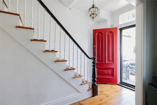 24 8th St, Hudson, NY 12534 - entryway featuring light wood-type flooring, stairs, and ornamental molding