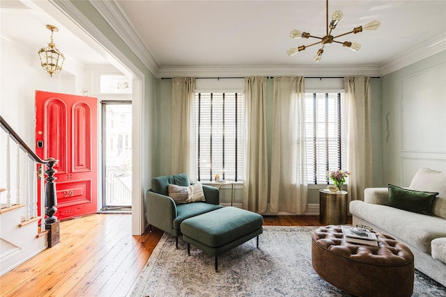 24 8th St, Hudson, NY 12534 - living area with wood-type flooring, crown molding, and stairs