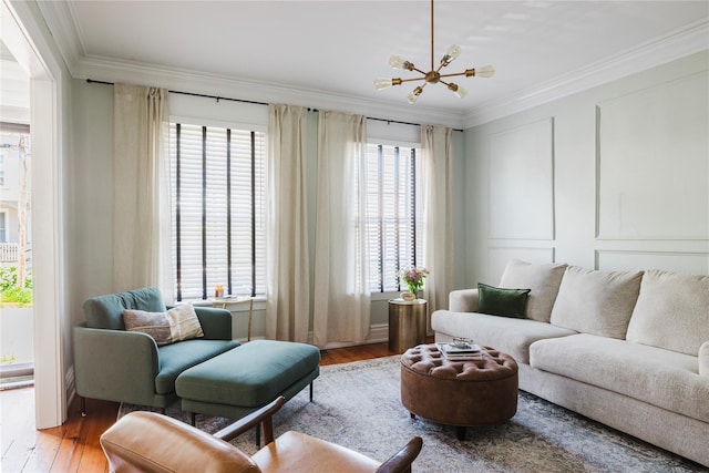 24 8th St, Hudson, NY 12534 - living room featuring crown molding, wood finished floors, and a chandelier