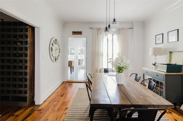 24 8th St, Hudson, NY 12534 - dining area featuring light wood-style flooring and crown molding