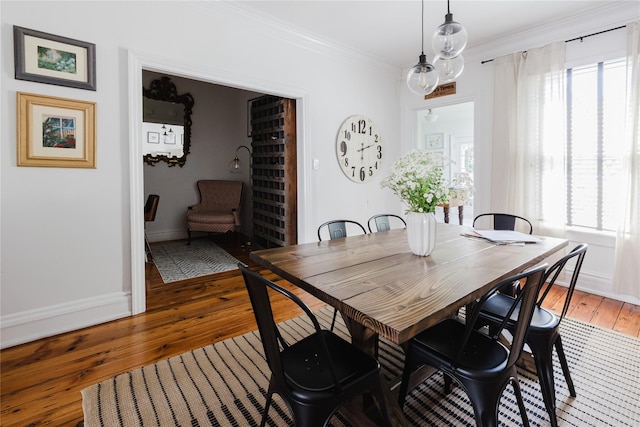 24 8th St, Hudson, NY 12534 - dining space with light wood finished floors and ornamental molding