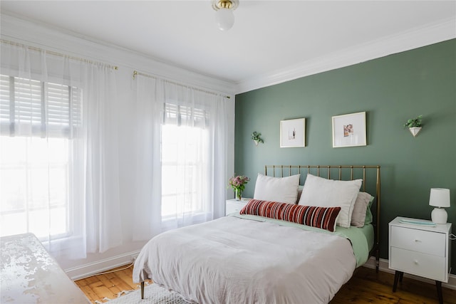 24 8th St, Hudson, NY 12534 - bedroom with multiple windows, crown molding, and wood finished floors