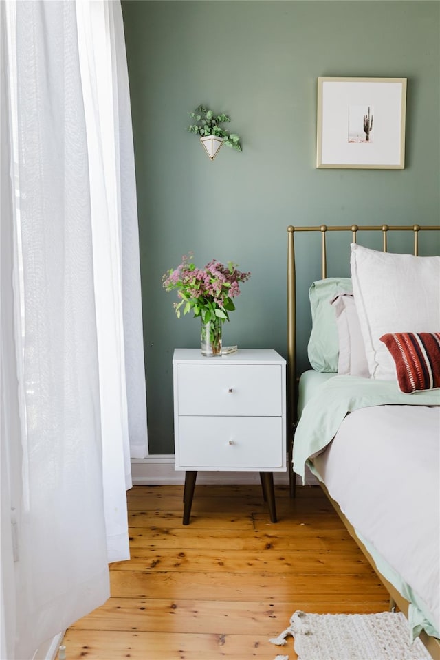 24 8th St, Hudson, NY 12534 - bedroom with wood-type flooring and baseboards