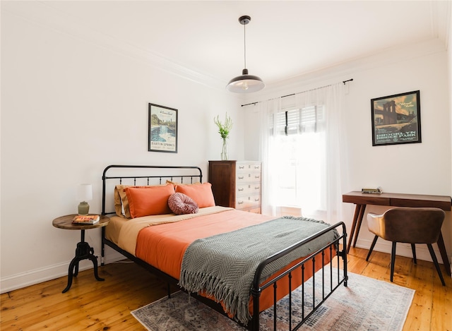 24 8th St, Hudson, NY 12534 - bedroom with light wood-type flooring and ornamental molding
