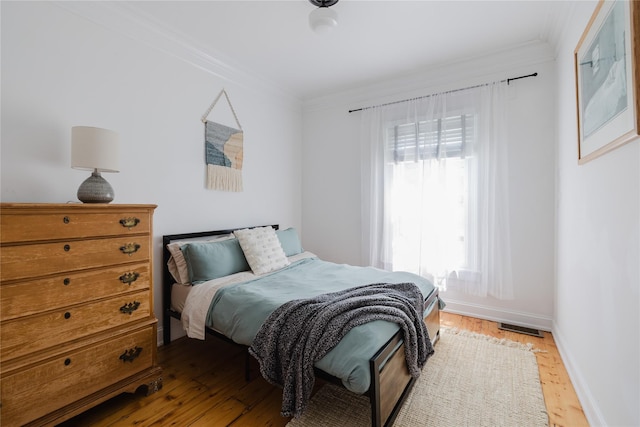 24 8th St, Hudson, NY 12534 - bedroom with ornamental molding and wood finished floors