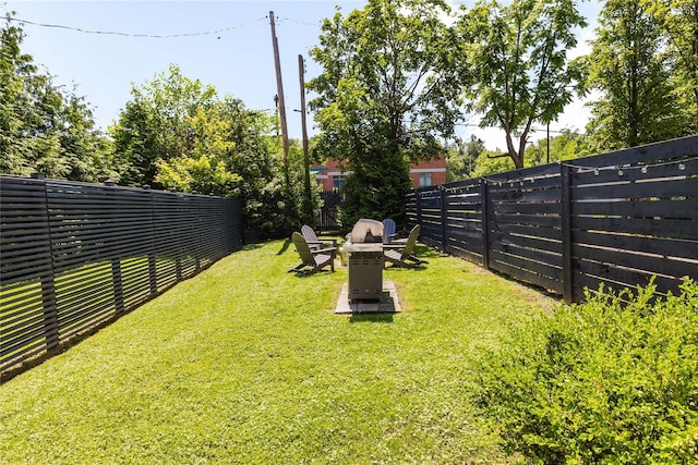 24 8th St, Hudson, NY 12534 - fenced backyard with an outdoor fire pit