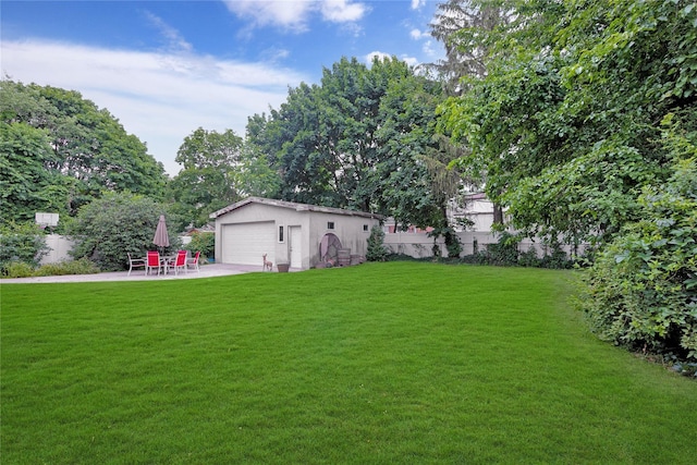 181 Walnut St, Lynbrook, NY 11563 - view of yard with an outdoor structure, a garage, and a patio