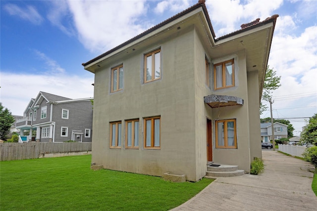 181 Walnut St, Lynbrook, NY 11563 - back of house featuring stucco siding
