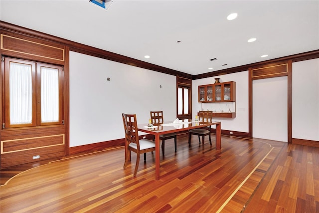 181 Walnut St, Lynbrook, NY 11563 - dining room featuring wood finished floors, ornamental molding, and recessed lighting