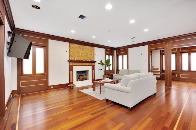 181 Walnut St, Lynbrook, NY 11563 - living room featuring wood finished floors, a large fireplace, recessed lighting, and crown molding