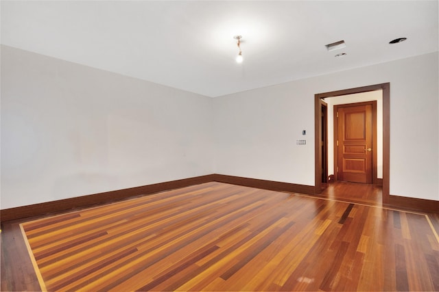 181 Walnut St, Lynbrook, NY 11563 - empty room with baseboards and wood finished floors